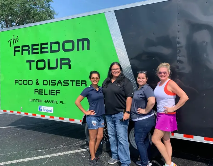 Lake Wales Access team beside the Freedom Tour relief trailer