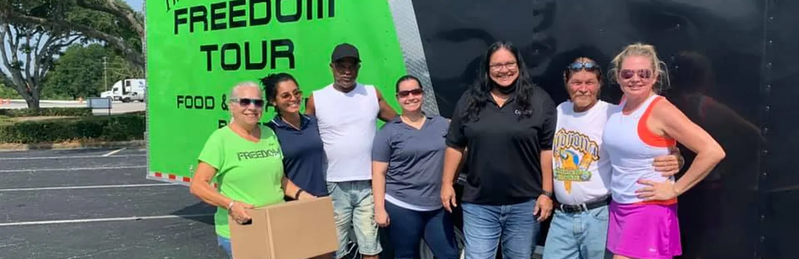 Lake Wales Access team beside the Freedom Tour relief trailer