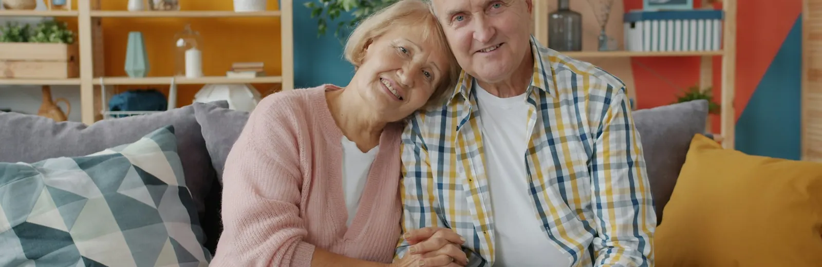Older couple reviewing paperwork together with an advisor