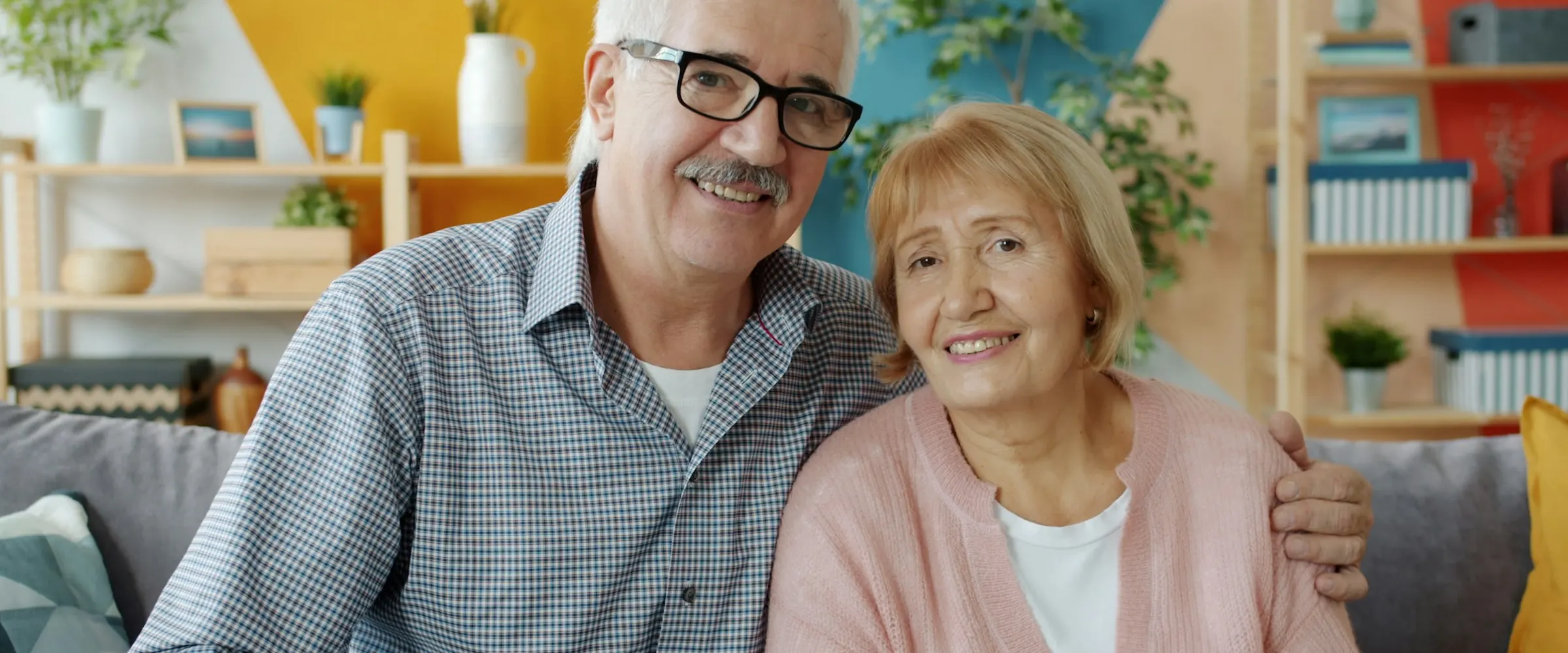 Older couple smiling together at home