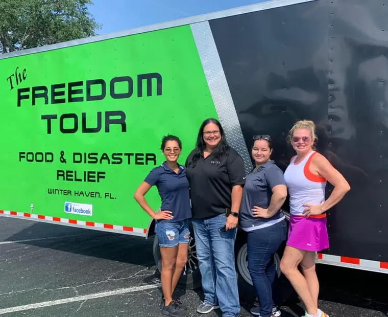 Lake Wales Access team beside the Freedom Tour food and disaster relief trailer